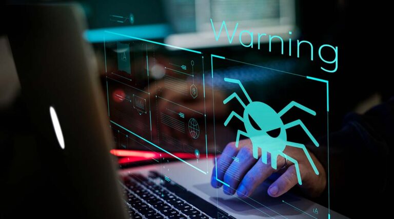 Une personne utilise un ordinateur portable sur lequel sont affichés un message d'avertissement et une icône de virus en dessin animé, mettant en évidence des catégories d'attaques informatiques telles que les menaces pour la cybersécurité ou les alertes aux logiciels malveillants.
